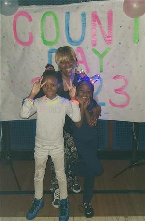 Ms. Tupper takes picture with students